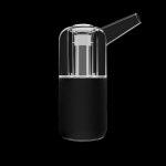 Clear glass and carbon fiber cannabis oil rig with a mouthpiece.