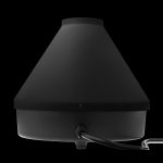 Black cannabis vaporizer on a dark background.