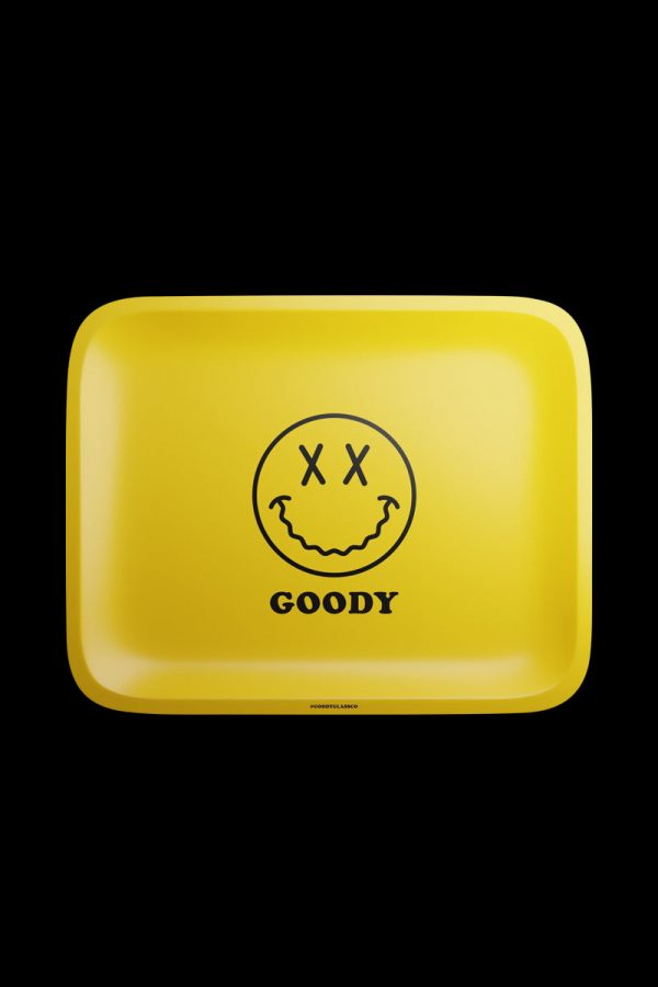The Goody Glass Yellow Big Face Rolling Tray is pictured from above, showing a square yellow tray with a smiling face graphic.