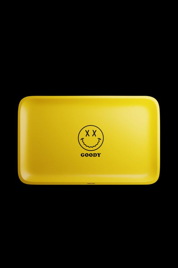 A top-down view of the Goody Glass Yellow Big Face Rolling Tray, featuring a large circular graphic on a yellow surface.