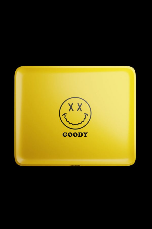The Goody Glass Yellow Big Face Rolling Tray is shown in a flat lay, displaying a bright yellow surface with a large graphic face design.