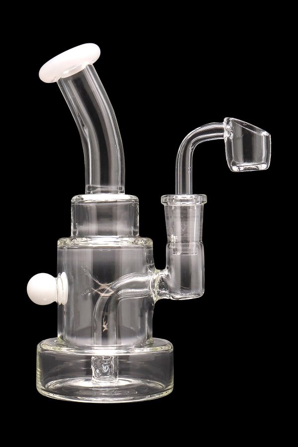 Clear glass dab rig with a quartz banger and colorful accents.