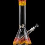 Glass water pipe (bong) with orange and yellow swirl design against a black background.