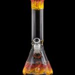Glass water pipe (bong) with orange and yellow swirling designs, isolated on a black background.