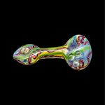 Colorful glass pipe with bubble detailing, isolated on a black background.