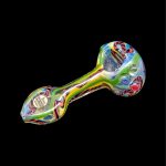 Colorful glass smoking pipe on a black background.