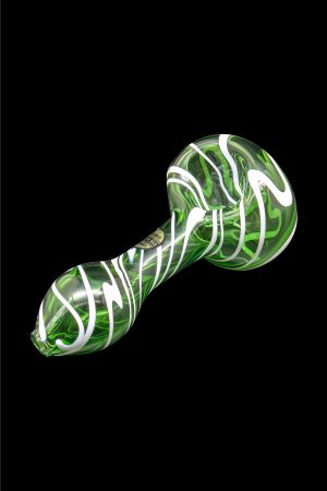 Green and white swirled glass spoon pipe against a black background.