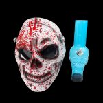 A bloody horror mask alongside a blue glass water pipe.