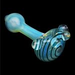 Blue glass pipe with swirling black and teal stripes, isolated on a black background.