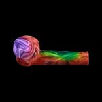 Colorful glass pipe on a black background.