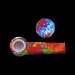 Colorful silicone pipe and cap isolated on a black background.