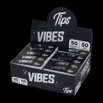 A close-up shot of the VIBES Rolling Tips Box - 50 Pack, displaying a stack of booklets with bold branding.