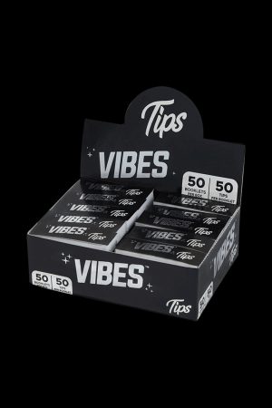 A close-up shot of the VIBES Rolling Tips Box - 50 Pack, displaying a stack of booklets with bold branding.