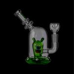 Green glass cannabis water pipe (rig) with a cartoon monster design.
