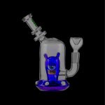 Blue glass water pipe with a monster-themed design.