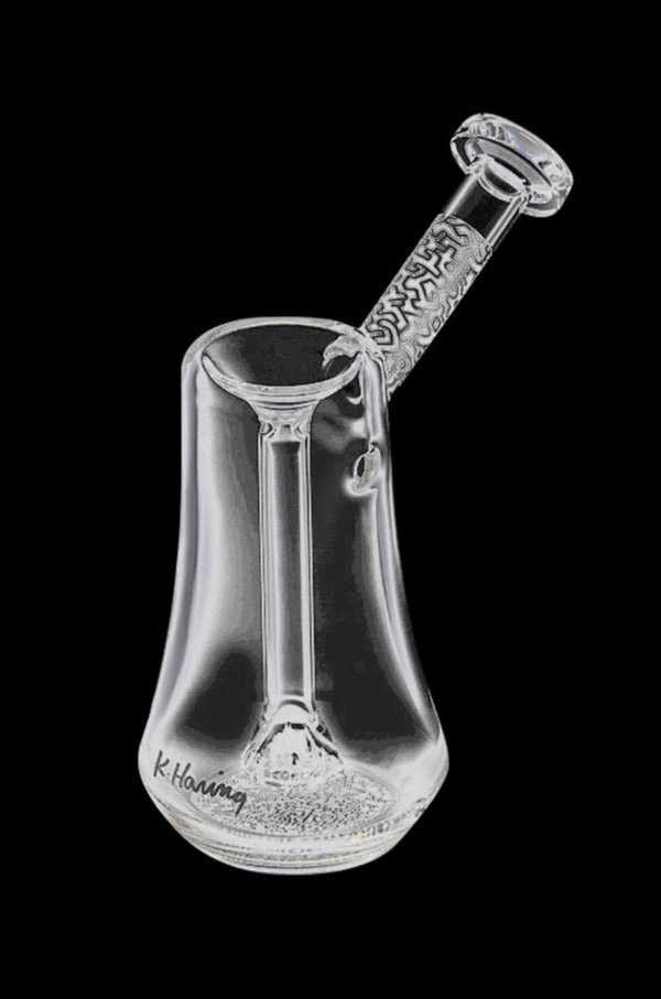 A front view of the K. Haring Glass Bubbler, showcasing its clear glass construction and unique design.