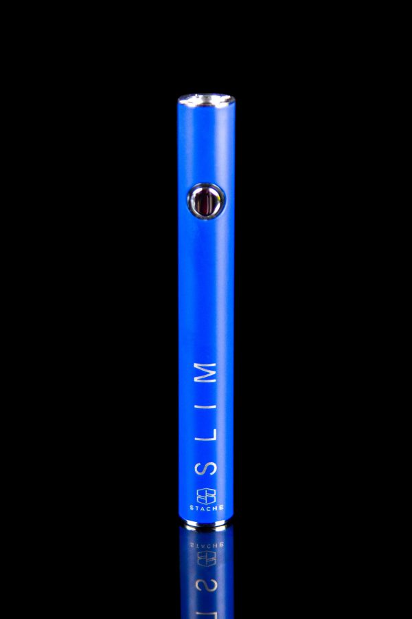 Blue cannabis oil vape pen with “SLIM” and “STACHE” branding against a black background.