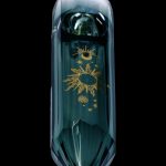 Emerald green glass water pipe with gold celestial designs.