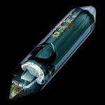 Emerald green glass pipe with gold celestial designs and visible cannabis inside, set against a black background.