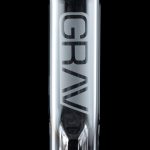 Clear glass water pipe with “GRAV” vertically printed along its length, against a black background.