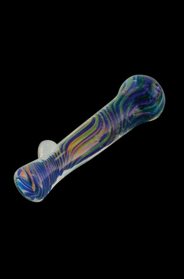 A close-up shows the Multicolor Borosilicate Glass Chillum Taster with a vibrant, multicolored design against a black backdrop.