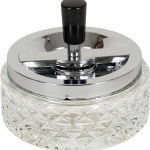 A close-up, angled view of the Glass Spinning Ashtray, showcasing its clear glass construction and rotating design.