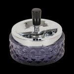 A top-down view of the Glass Spinning Ashtray, featuring a clear glass design with a rotating top.