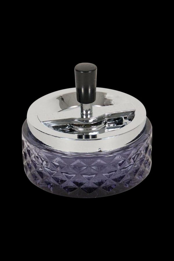 A top-down view of the Glass Spinning Ashtray, featuring a clear glass design with a rotating top.