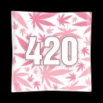 Pink glass ashtray with white “420” lettering and cannabis leaf pattern.
