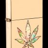 Gold Zippo lighter with a colorful cannabis leaf design.
