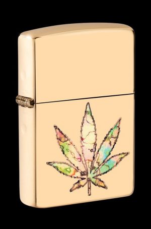 Gold Zippo lighter with a colorful cannabis leaf design.