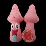 Pink Patrick Star-shaped silicone dab rig with a glass insert, isolated on a black background.