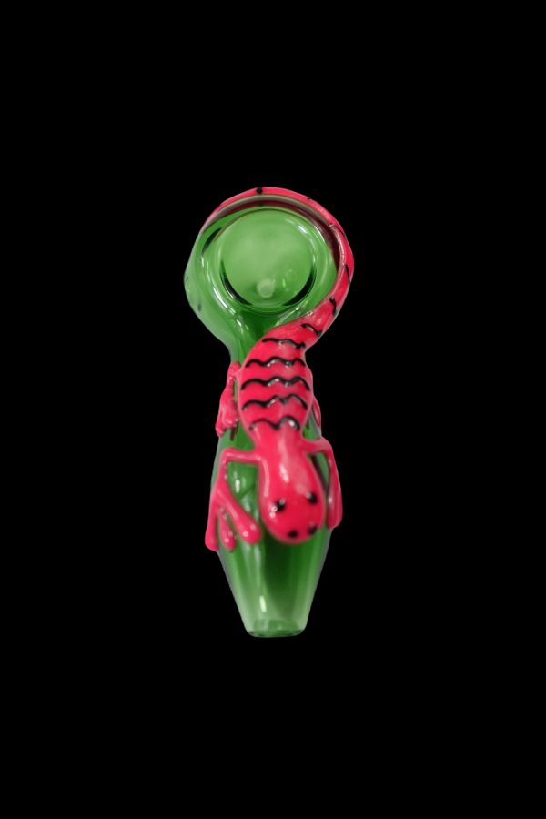Green glass pipe sculpted with a red scorpion design.