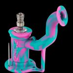 Pink and teal silicone oil rig with a quartz banger and dab tool.