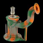 Green and orange silicone rig with a metal downstem and bowl, isolated on a black background.