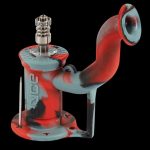 Silicone cannabis rig with a glass bowl and dab tool.