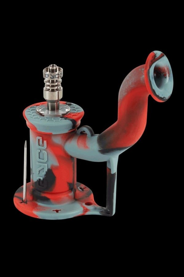 Silicone cannabis rig with a glass bowl and dab tool.