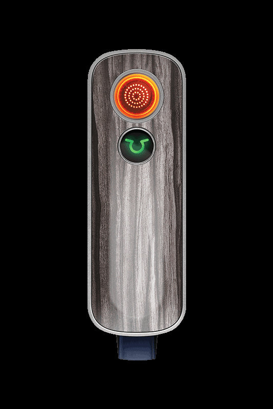Sleek, wood-grain portable vaporizer with illuminated controls.