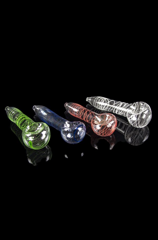 Assortment of colorful glass smoking pipes on a reflective black surface.