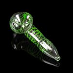 Green glass pipe with swirling white accents, isolated on a black background.