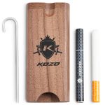 Wooden dugout with a branded logo, a metal packing tool, and a pre-rolled cigarette.