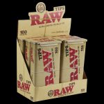 A close-up of the RAW Pre-Rolled Tips - 6 Pack (600 Tips) showing a stack of white booklets with the brand logo prominently displayed.