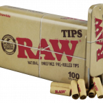 A close-up, angled shot of a stack of RAW Pre-Rolled Tips, featuring the branded packaging in the background.