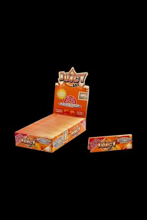 A close-up of the branded packaging for Juicy Jay's 1 1/4 Peaches and Cream Rolling Papers, displaying vibrant peach and cream colors.