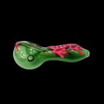 Green glass pipe with pink accents, side view against a black background.