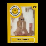 Front view of the Goody Glass The Chief Mini Rig 4-Piece Kit, showing a clear glass rig with a unique circular logo.