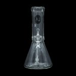 Clear glass beaker bong with intricate percolator, isolated on black.