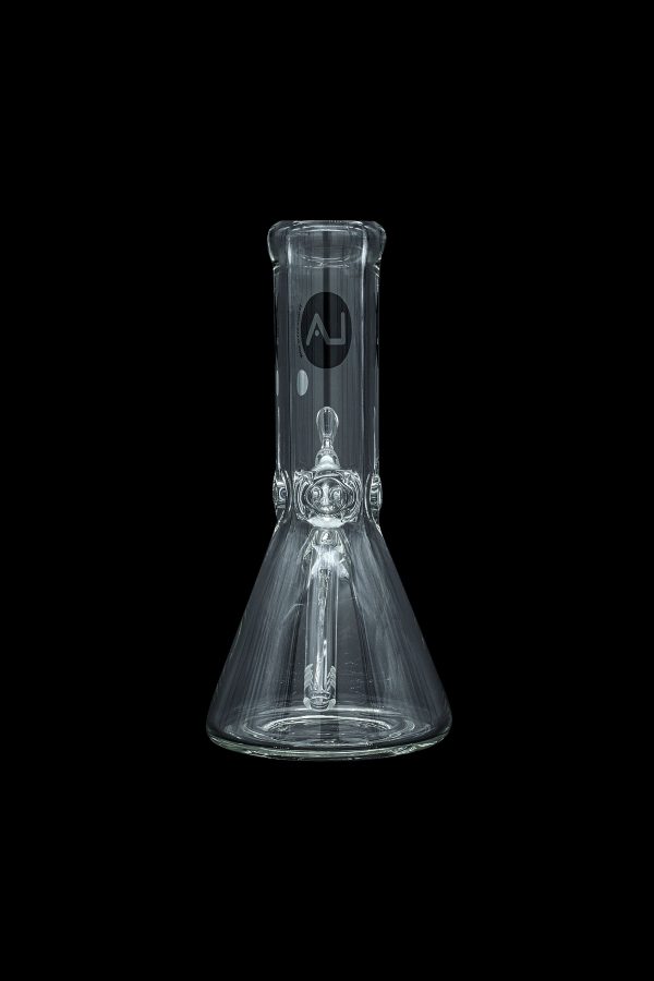 Clear glass beaker bong with intricate percolator, isolated on black.