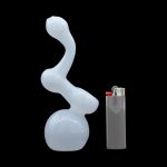 Frosted glass water pipe (bong) next to a lighter on a black background.