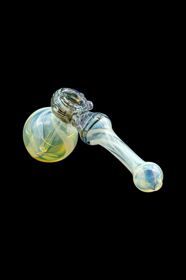 Hand-blown glass bubbler pipe with iridescent blue and gold swirls, isolated on black.